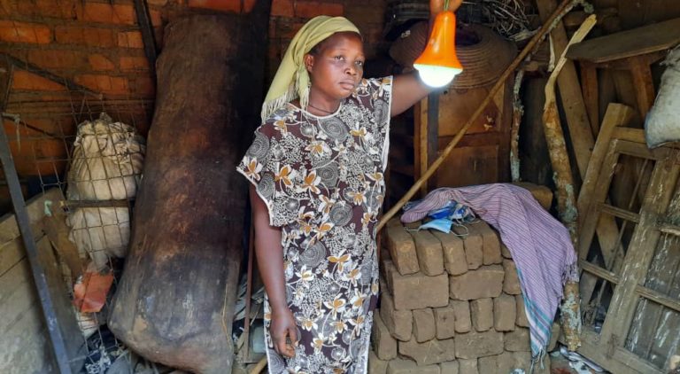 Woman with solar lamp