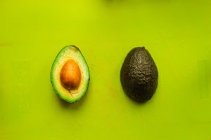 photo of an avocado sliced in half